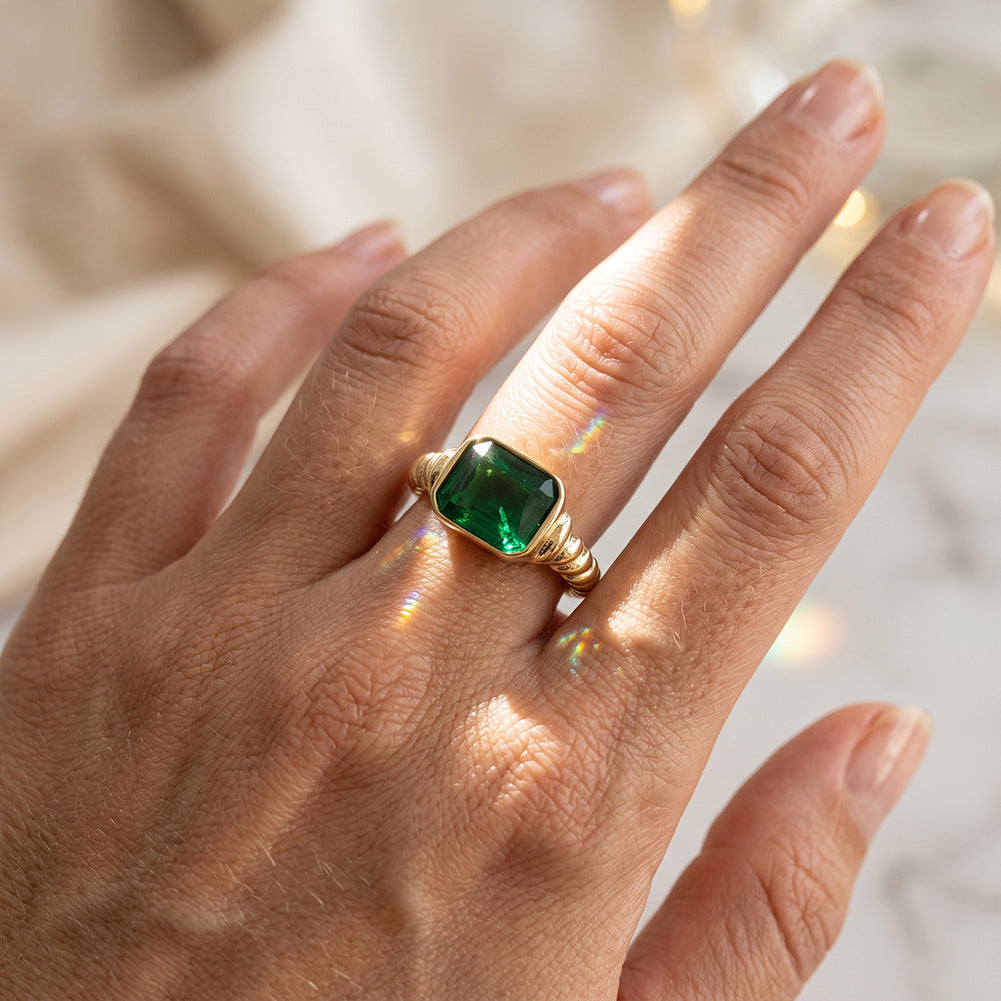 Stainless Steel Gold Plated Twisted Band Ring with Rectangle Emerald Green CZ Stone