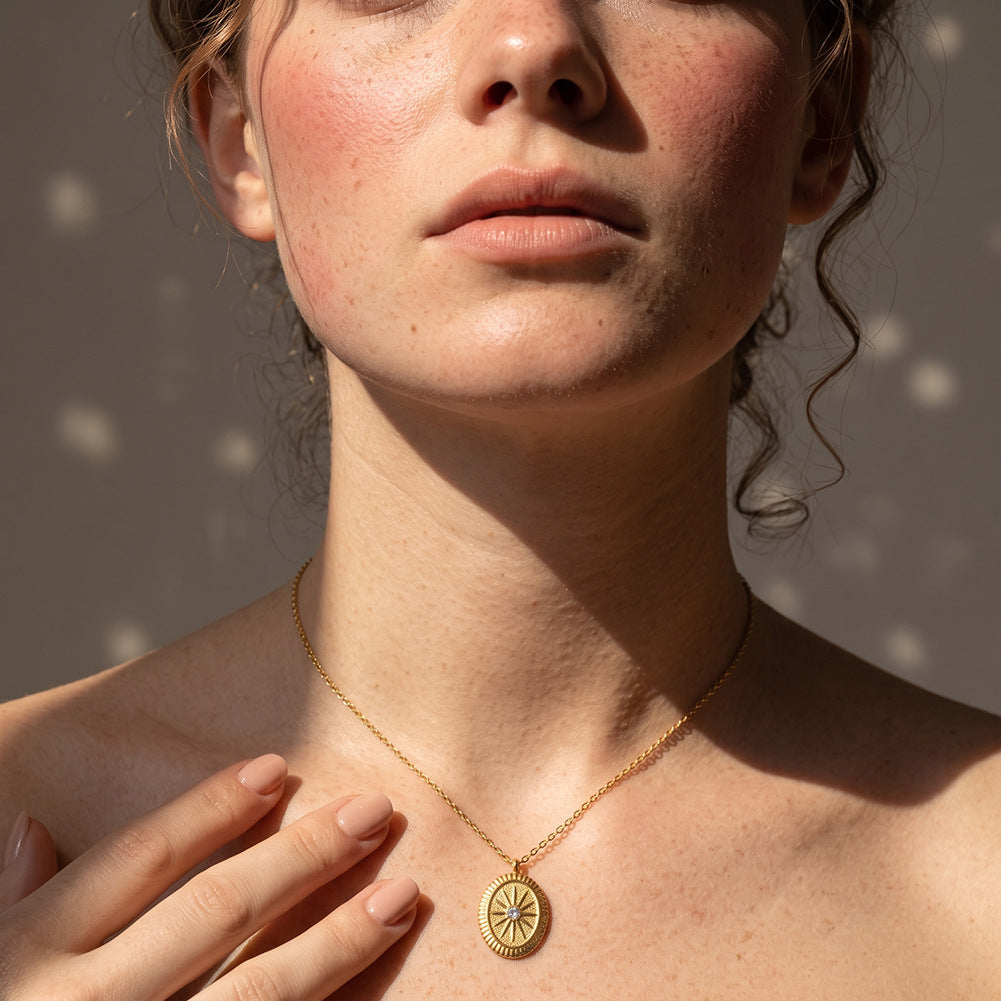 Stainless Steel Oval Sunburst Medallion Necklace, Textured Oval Sunburst Pendant with Central Sparkling CZ Stone, Vintage Hammered Surface Design