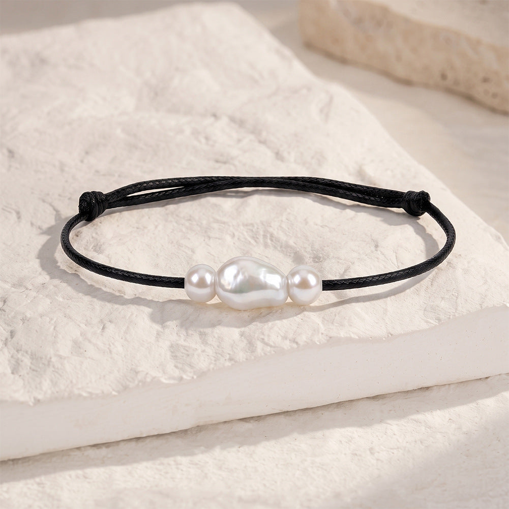 Adjustable Black Wax Cord Bracelet, Lustrous Baroque Freshwater Pearl Center Flanked by Two Small Round Pearls, Sliding Knot Design