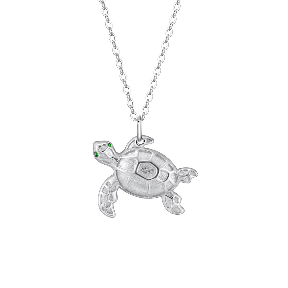 Gold Stainless Steel Sea Turtle Pendant Necklace, Textured Tortoise Charm with Green CZ Eyes on Thin Rolo Cable Chain