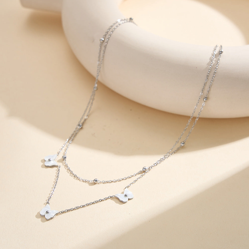 Gold Stainless Steel Double Layer Butterfly Necklace, Two-Tier Stacked Rolo Chain with White Enamel Butterfly Charms & Gold Bead Details