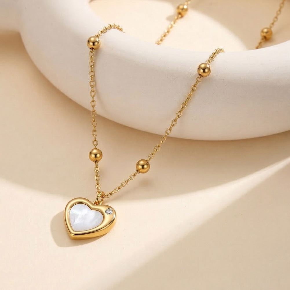 Gold Stainless Steel Heart Pendant Necklace, White Mother of Pearl Inlay Heart Charm with Single Clear CZ, Station Bead Rolo Chain