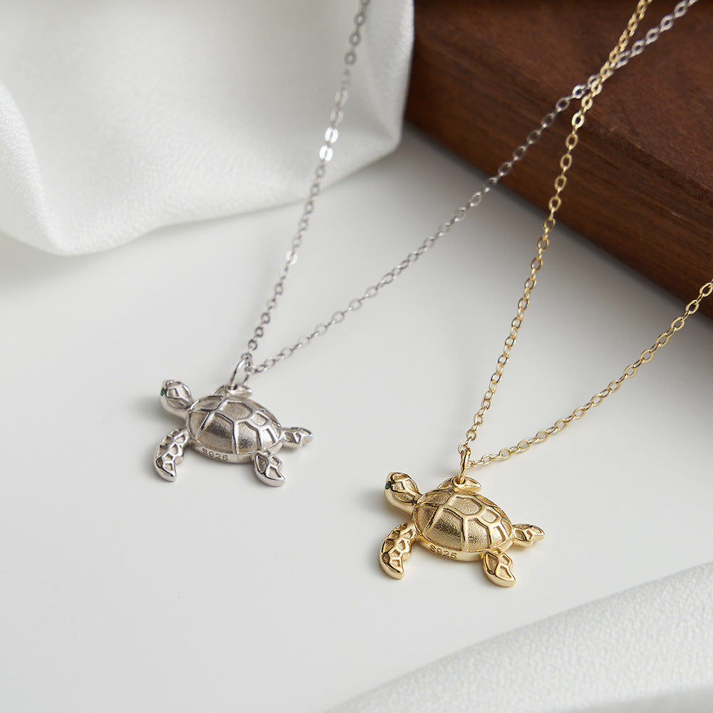 Gold Stainless Steel Sea Turtle Pendant Necklace, Textured Tortoise Charm with Green CZ Eyes on Thin Rolo Cable Chain