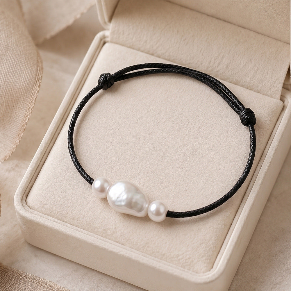 Adjustable Black Wax Cord Bracelet, Lustrous Baroque Freshwater Pearl Center Flanked by Two Small Round Pearls, Sliding Knot Design
